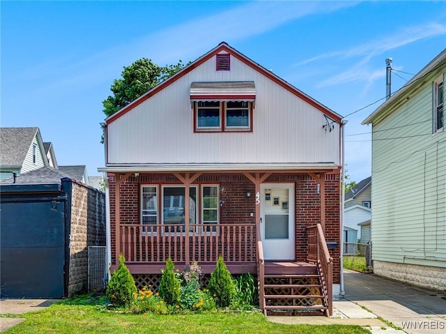 45 Eckhert St, Buffalo, NY 14207 - view of front facade with a porch and brick siding
