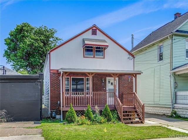 45 Eckhert St, Buffalo, NY 14207 - view of front of home featuring a porch and brick siding