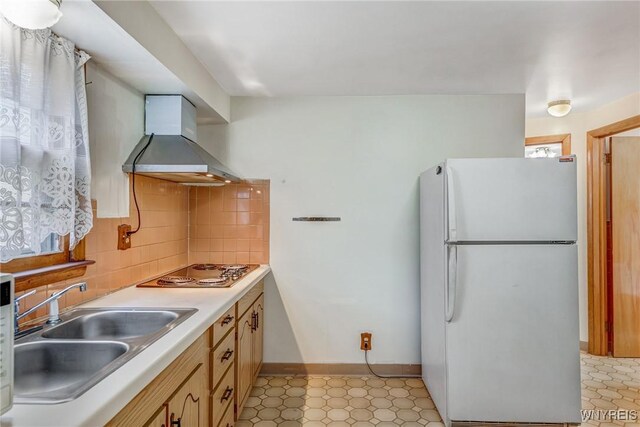 45 Eckhert St, Buffalo, NY 14207 - kitchen with freestanding refrigerator, wall chimney range hood, electric stovetop, tasteful backsplash, and light countertops