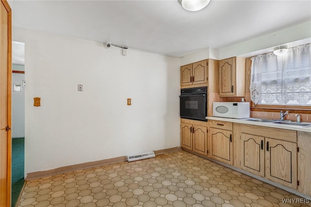 45 Eckhert St, Buffalo, NY 14207 - kitchen with black oven, white microwave, and light countertops
