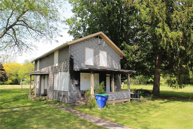136 Knapp St, Albion, NY 14411 - view of front of house featuring covered porch and a front yard