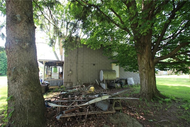 136 Knapp St, Albion, NY 14411 - view of home's exterior with concrete block siding and a yard