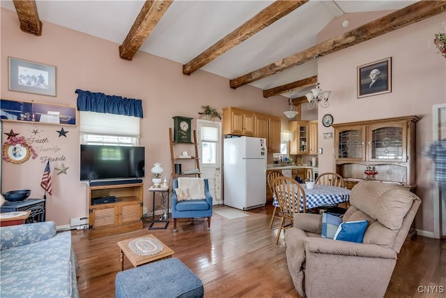 6685 State Route 26, Martinsburg, NY 13404 - living room featuring beamed ceiling, wood finished floors, and a baseboard radiator