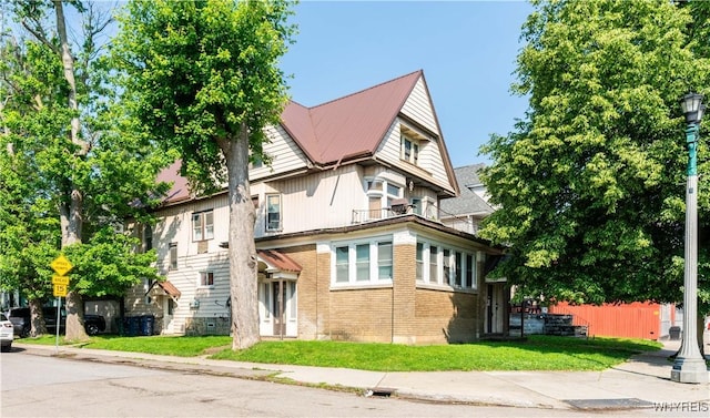 2009 Seneca St, Buffalo, NY 14210 - view of front of house featuring a balcony and a metal roof