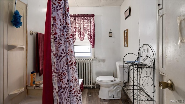 2009 Seneca St, Buffalo, NY 14210 - full bathroom with radiator, wood finished floors, and a shower with shower curtain