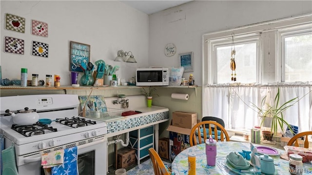 2009 Seneca St, Buffalo, NY 14210 - kitchen featuring white appliances