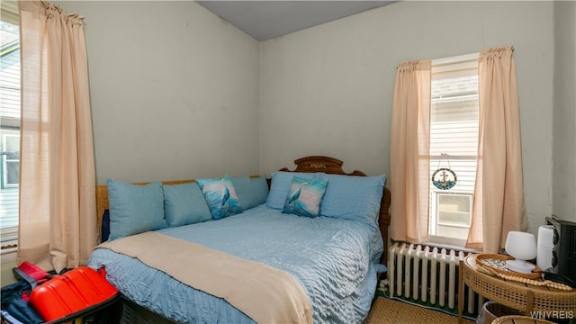 2009 Seneca St, Buffalo, NY 14210 - bedroom with radiator heating unit and multiple windows