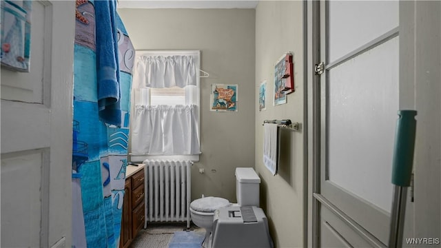 2009 Seneca St, Buffalo, NY 14210 - bathroom with radiator heating unit and toilet