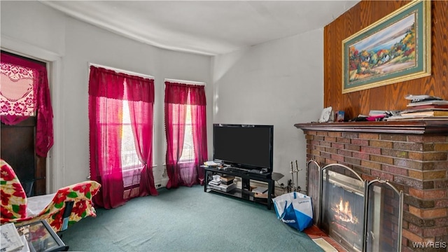 2009 Seneca St, Buffalo, NY 14210 - living area featuring carpet floors, a fireplace, and wood walls