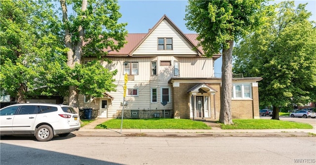 2009 Seneca St, Buffalo, NY 14210 - view of front of property with a metal roof and a front yard