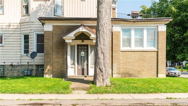 2009 Seneca St, Buffalo, NY 14210 - property entrance featuring brick siding and board and batten siding