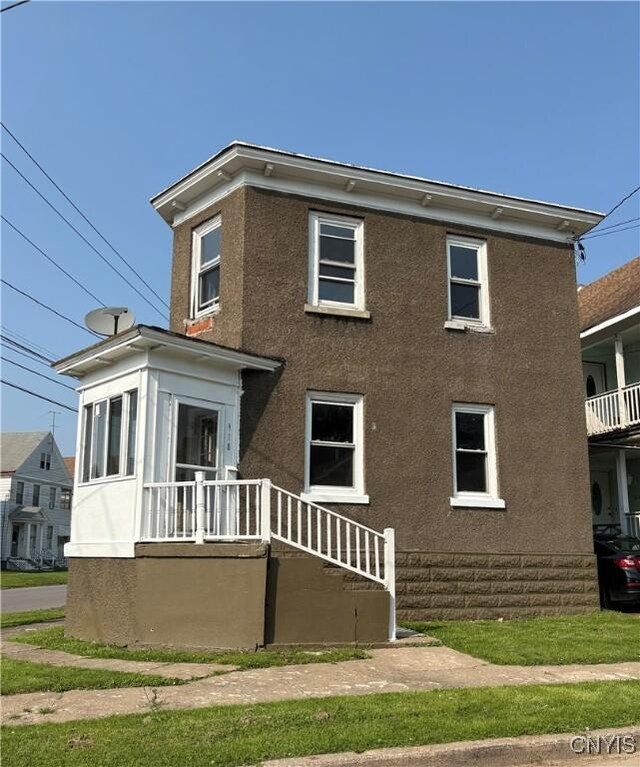 918 Shaw St, Utica, NY 13502 - view of front of home with stucco siding