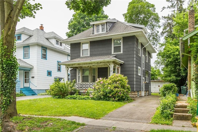77 Macbeth St, Rochester, NY 14609 - traditional style home featuring covered porch, a front yard, and roof with shingles