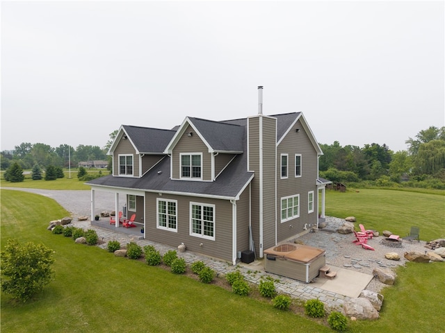 4582 Belwood Dr, Geneseo, NY 14454 - view of front facade featuring a patio, a front yard, a chimney, and an outdoor fire pit