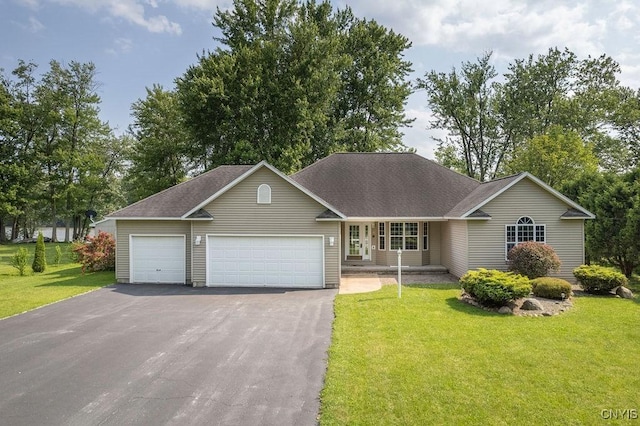 98 Krystyna Ln Unit 6, Cato, NY 13080 - view of front of home featuring a front yard, asphalt driveway, and a garage