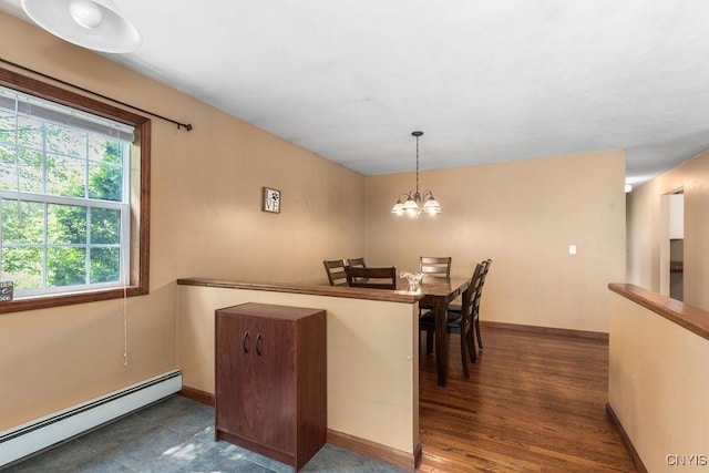 98 Krystyna Ln Unit 6, Cato, NY 13080 - kitchen with baseboard heating, a chandelier, and pendant lighting