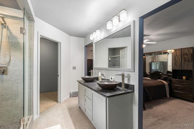 98 Krystyna Ln Unit 6, Cato, NY 13080 - bathroom with ensuite bathroom, double vanity, a stall shower, and ceiling fan