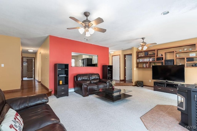 98 Krystyna Ln Unit 6, Cato, NY 13080 - carpeted living room with a ceiling fan