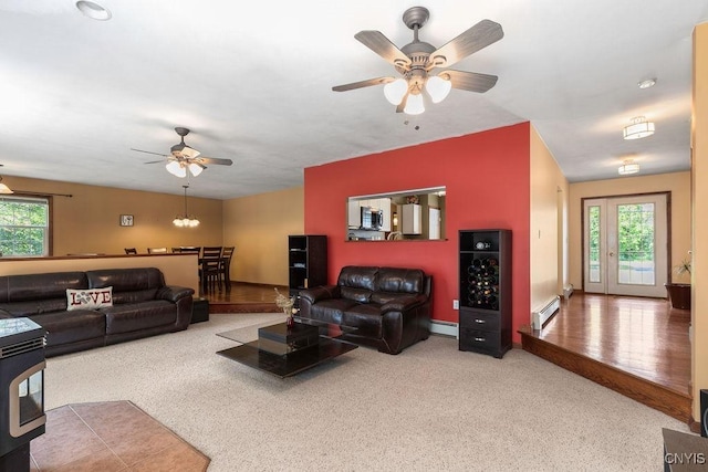 98 Krystyna Ln Unit 6, Cato, NY 13080 - living area with a ceiling fan, baseboard heating, and carpet