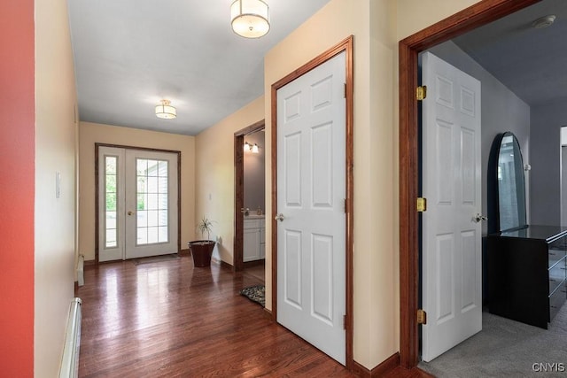 98 Krystyna Ln Unit 6, Cato, NY 13080 - entryway featuring a baseboard heating unit and dark wood-style floors