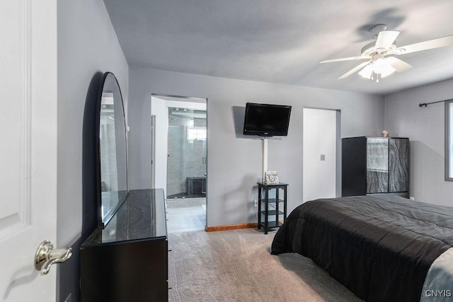 98 Krystyna Ln Unit 6, Cato, NY 13080 - bedroom with light colored carpet, ceiling fan, and connected bathroom
