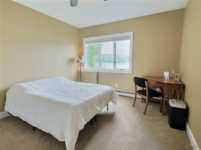 7530 Song Lake Rd, Preble, NY 13159 - carpeted bedroom featuring a baseboard radiator and a ceiling fan