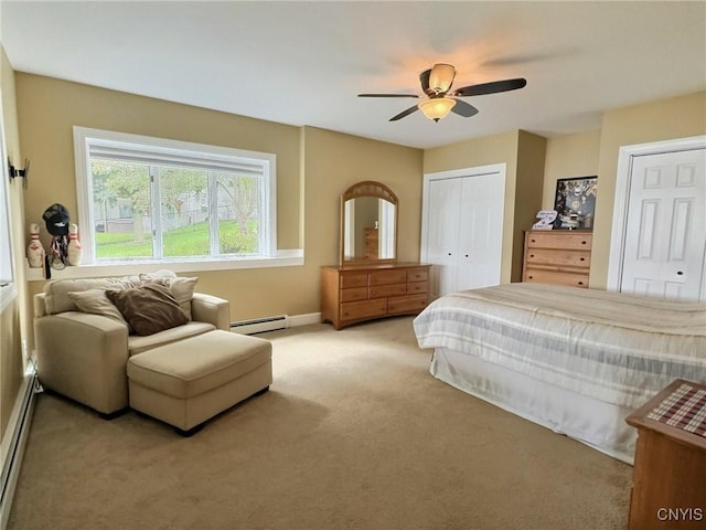 7530 Song Lake Rd, Preble, NY 13159 - bedroom with light carpet, a baseboard radiator, multiple closets, a baseboard heating unit, and ceiling fan