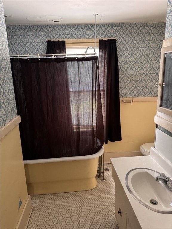 94 Wetmore Park, Rochester, NY 14606 - full bathroom with wallpapered walls, vanity, shower / tub combo, and tile patterned flooring