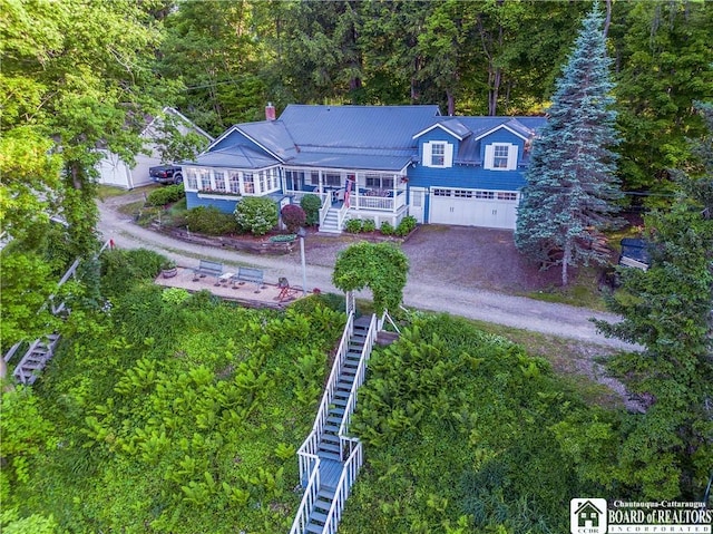 4896 Ashville Bay Rd, North Harmony, NY 14710 - view of front facade with stairway, a garage, and driveway