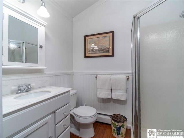 4896 Ashville Bay Rd, North Harmony, NY 14710 - bathroom featuring a baseboard radiator, ornamental molding, vanity, wood finished floors, and an enclosed shower