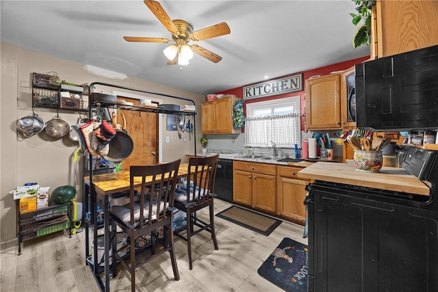 172 E 2nd St, Corning-City, NY 14830 - kitchen featuring black appliances, light wood-style floors, ceiling fan, and brown cabinets