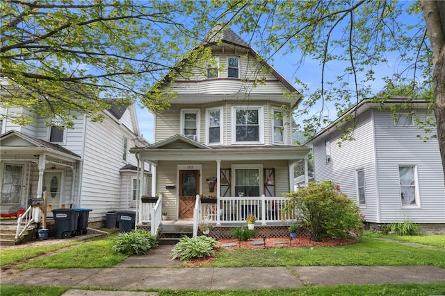 172 E 2nd St, Corning-City, NY 14830 - victorian-style house with covered porch and a front yard