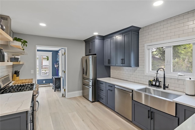 45 Croydon Rd, Rochester, NY 14610 - kitchen with stainless steel appliances, recessed lighting, plenty of natural light, tasteful backsplash, and a baseboard heating unit