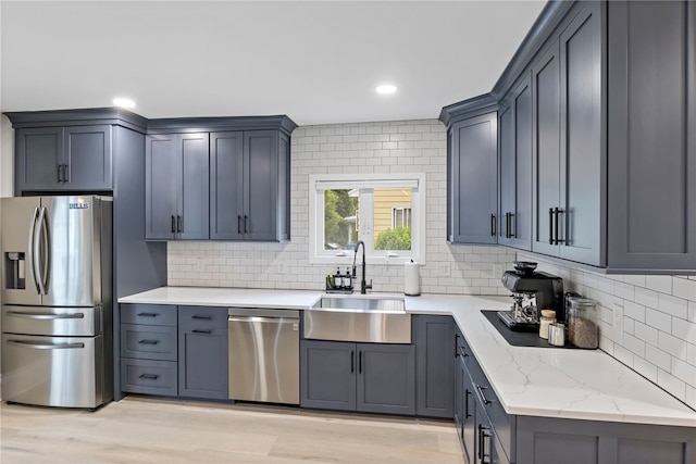 45 Croydon Rd, Rochester, NY 14610 - kitchen featuring appliances with stainless steel finishes, tasteful backsplash, recessed lighting, light wood-style floors, and light stone counters