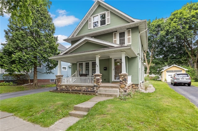45 Croydon Rd, Rochester, NY 14610 - american foursquare style home featuring covered porch, driveway, an outdoor structure, a front lawn, and a garage