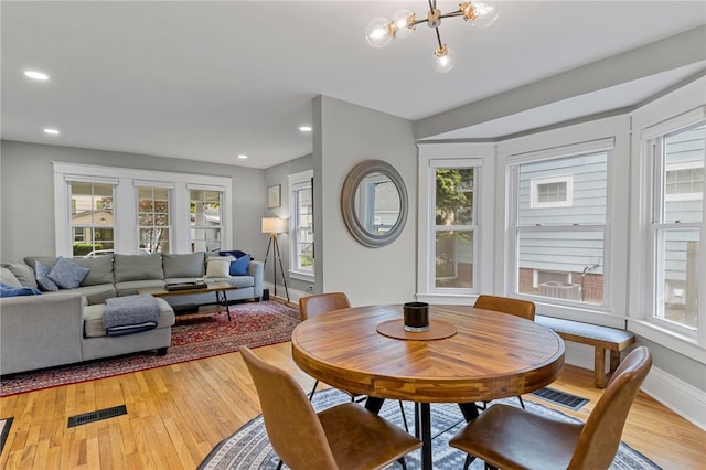 45 Croydon Rd, Rochester, NY 14610 - dining area featuring healthy amount of natural light, light wood-style flooring, a chandelier, and recessed lighting