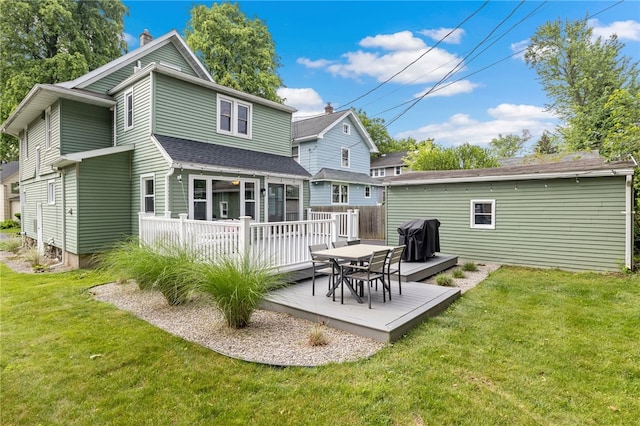 45 Croydon Rd, Rochester, NY 14610 - back of property with a wooden deck, a chimney, a yard, and roof with shingles