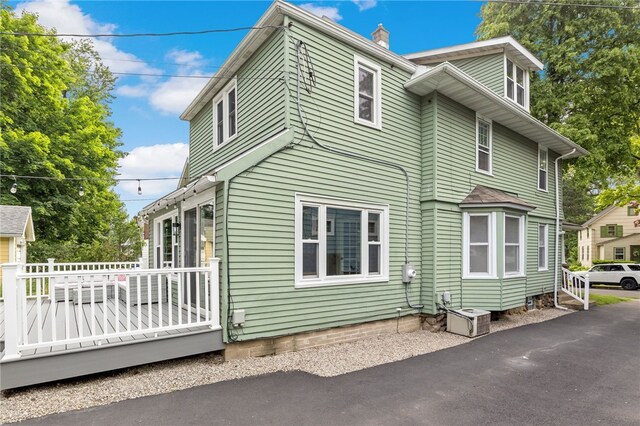 45 Croydon Rd, Rochester, NY 14610 - view of home's exterior featuring a wooden deck and a chimney