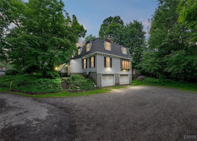 13 Dodd St, Whitestown, NY 13492 - view of front of property with a garage, mansard roof, roof with shingles, driveway, and stairway