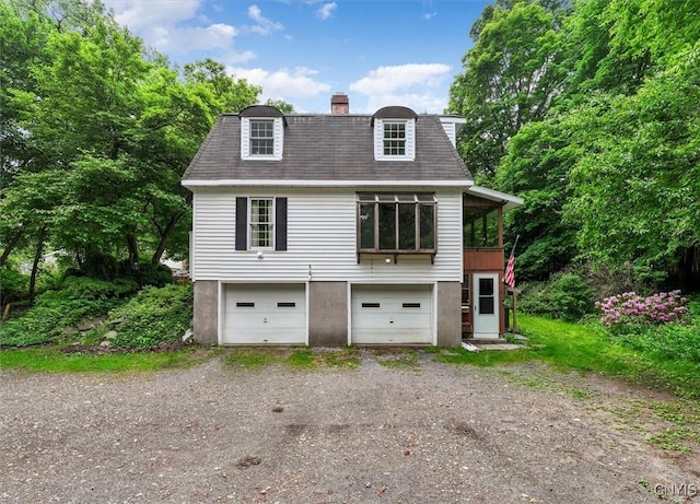 13 Dodd St, Whitestown, NY 13492 - view of front of property featuring driveway, a chimney, and an attached garage