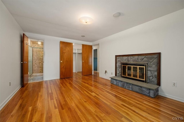 13 Dodd St, Whitestown, NY 13492 - unfurnished living room featuring wood finished floors and a fireplace
