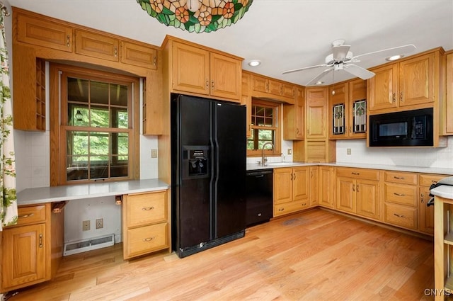 13 Dodd St, Whitestown, NY 13492 - kitchen with black appliances, light wood finished floors, recessed lighting, light countertops, and decorative backsplash
