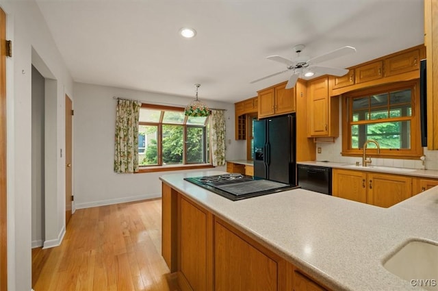 13 Dodd St, Whitestown, NY 13492 - kitchen featuring black appliances, light countertops, light wood-type flooring, healthy amount of natural light, and recessed lighting