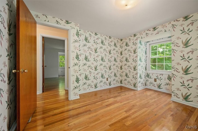 13 Dodd St, Whitestown, NY 13492 - spare room featuring light wood-type flooring and wallpapered walls