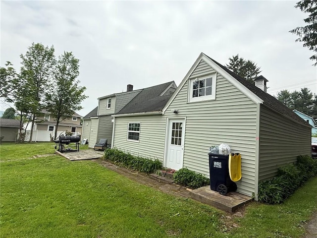 114 W Main St, Sidney, NY 13838 - rear view of property with a yard, a patio, and a chimney