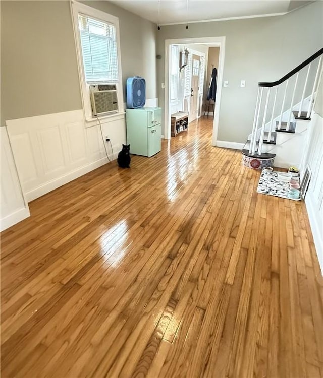 114 W Main St, Sidney, NY 13838 - spare room with stairs, hardwood / wood-style floors, plenty of natural light, and wainscoting