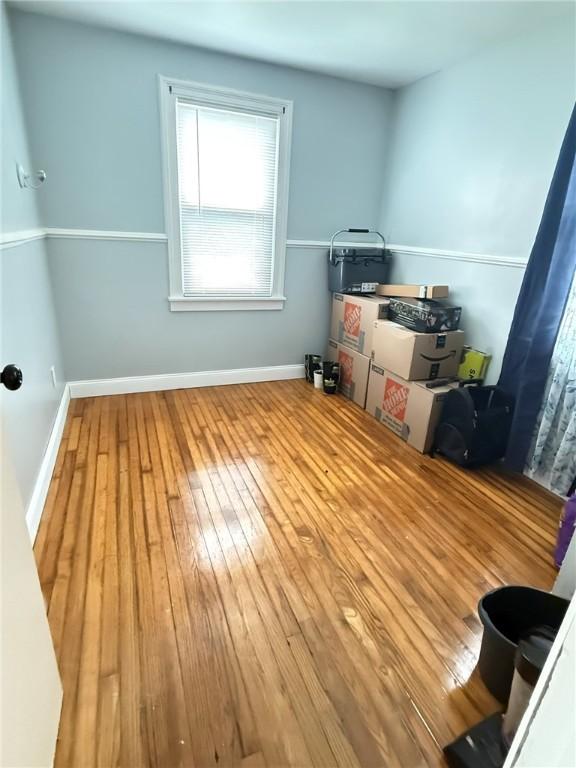 114 W Main St, Sidney, NY 13838 - spare room featuring hardwood / wood-style flooring