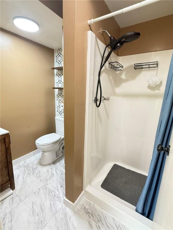 114 W Main St, Sidney, NY 13838 - bathroom with marble finish flooring, a stall shower, and vanity