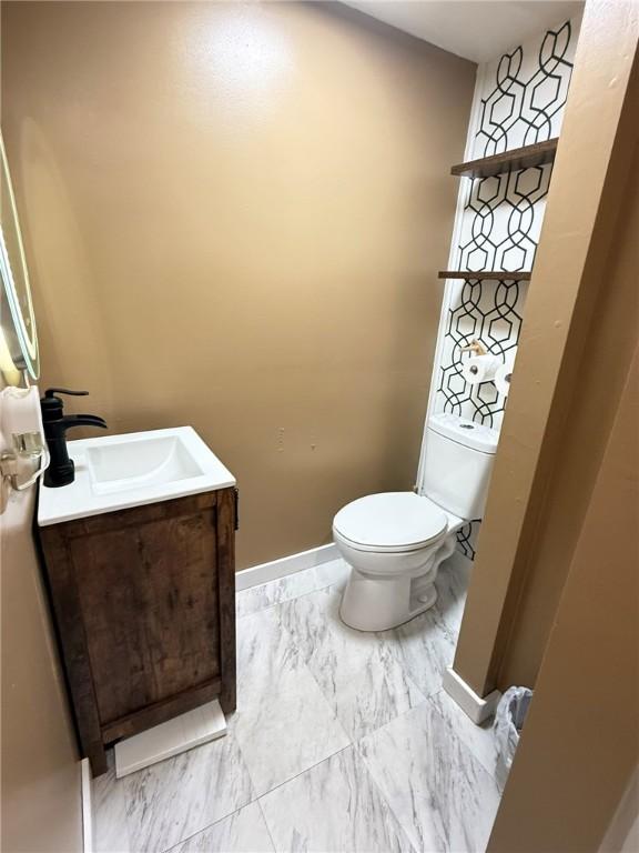 114 W Main St, Sidney, NY 13838 - half bath with vanity and marble look tiles