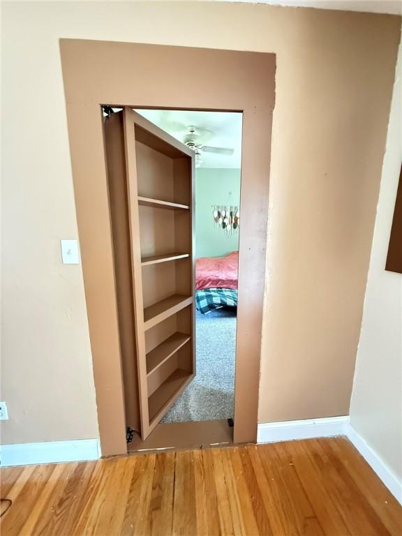114 W Main St, Sidney, NY 13838 - corridor with wood finished floors and baseboards